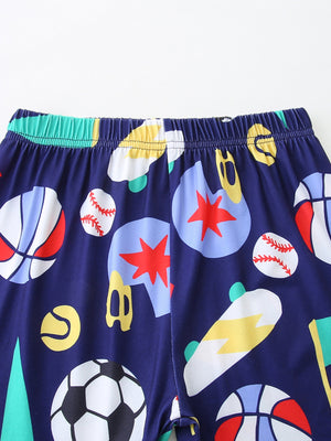 Navy blue baby shorts with sporty print of basketballs, baseballs, skateboards, and soccer balls.