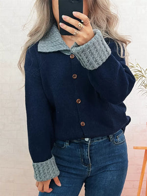 Navy button-down cardigan with textured grey collar and cuffs.