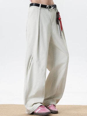 Men's cream pocketed wide leg sweatpants with belt loops and a drawstring detail.