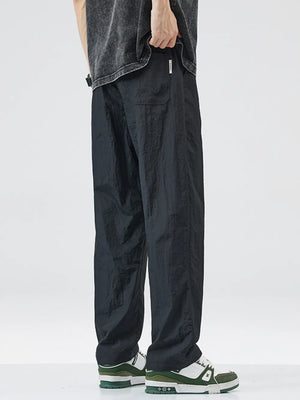 Black relaxed fit wide-leg casual sweatpants with pockets and a drawstring waist.
