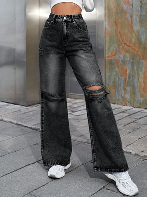 Distressed wash wide leg jeans in dark gray with ripped details.