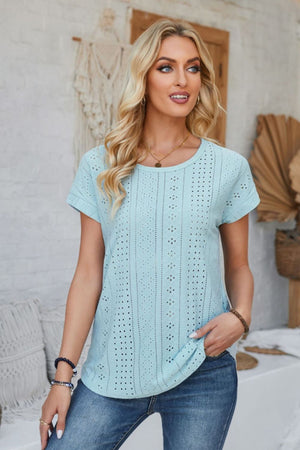 Light blue perforated eyelet cuffed tee with short sleeves and a crew neck.