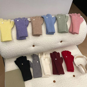Convertible ribbed knit touchscreen gloves in multiple colors with ruffled cuffs and a button detail.
