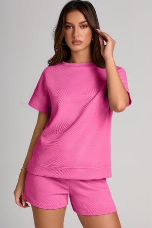 Fuchsia pink geometric quilted tee and shorts set with short sleeves and a crew neck.