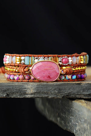 Bohemian wrap bracelet with pink stone and colorful beads on leather cords