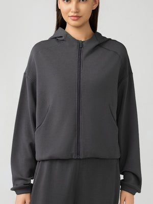 Dark gray cropped active hoodie with zipper, raglan sleeves, and pockets