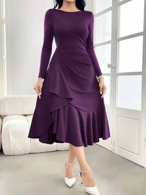 Purple midi dress with boat neck, long sleeves, ruffled tiers and a thigh slit.