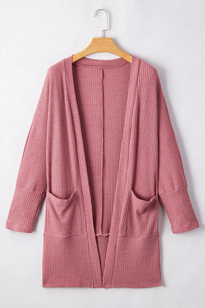 Dusty pink waffle knit open front cardigan with pockets and long sleeves.