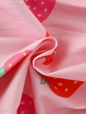 Baby dress in pink cotton blend with allover strawberry print and puff sleeve detail.