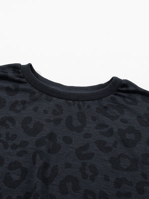 Dark gray crew neck pajama top with subtle leopard print and ribbed neckline.