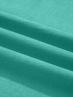 Teal mineral wash cotton tee with soft texture and subtle ribbing detail.
