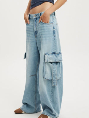 Light blue relaxed fit maternity cargo jeans with large side pockets and ankle length.