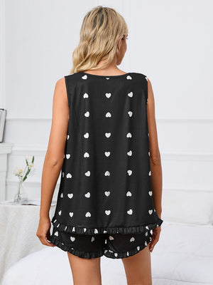 Black heart print loungewear set with ruffle hem shorts and sleeveless top.