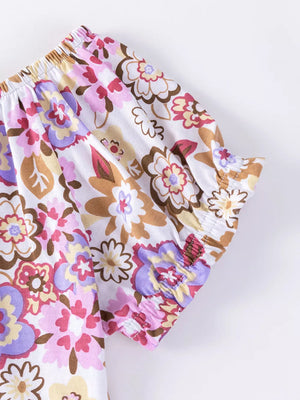 Girls' floral print cotton top with ruffled sleeves and elastic neckline.