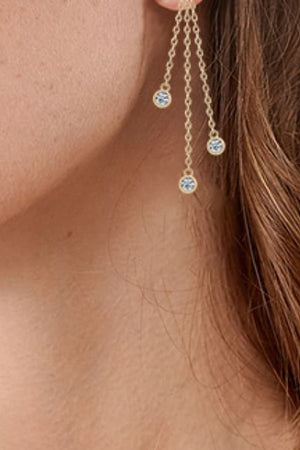 Gold cascading chain earrings with three crystal charms.