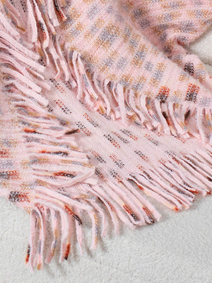 Textured fringe shawl cardigan in blush pink acrylic with a subtle patterned knit and fringe detail.
