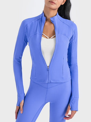 Ribbed performance zip-up track jacket in Cobalt Blue with thumbholes and a stand-up collar.
