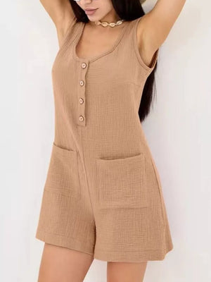 Khaki crinkled cotton button-down sleeveless romper with patch pockets.