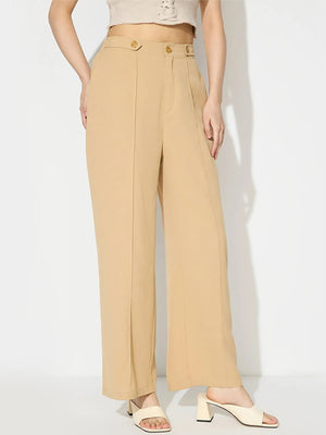 Tan tailored seam front wide leg trousers with button detail.