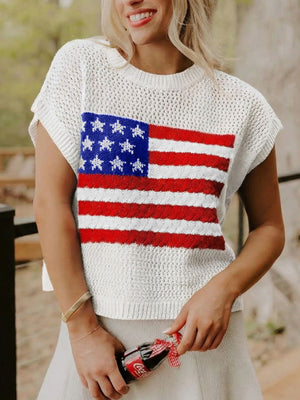 White knit short-sleeve top with American flag pattern, crew neck, and cable knit detail.