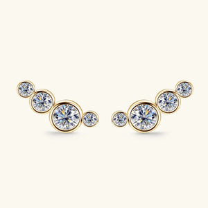 Gold ear climbers with a cluster of five round clear crystals on each earring.