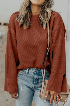 Textured knit sweater in ochre with crewneck and slit bell sleeves.