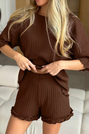 Brown ribbed pajama set with ruffled trim on sleeves and shorts.