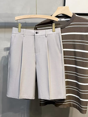 Light Gray Pleated Front Casual Men's Chino Shorts with button closure and side pockets.