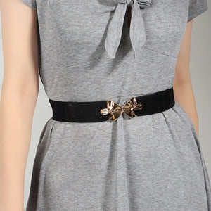 Black elasticated waist belt with gold bow clasp