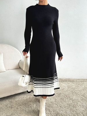 Black ribbed knit midi dress with contrast striped hem and mock neck.