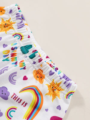 Girls' white graphic tee and shorts set with sun, rainbow, and cloud prints.