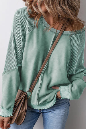 Waffle knit raglan sweatshirt in Gum Leaf with contrast body and raw hem details.