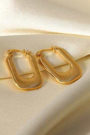 Gold textured rectangular hoop earrings with ribbed detail