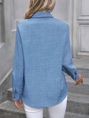 Blue linen-blend button-down shirt with long sleeves and a collared neckline.