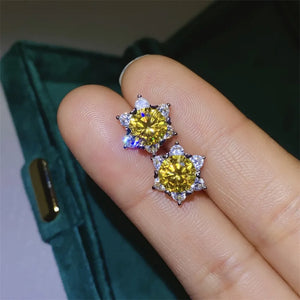 Golden sunburst moissanite stud earrings in 925 sterling silver with yellow center stones.