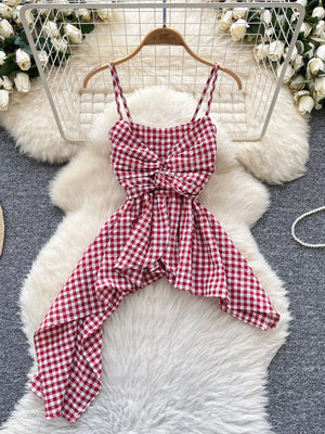 Red gingham asymmetrical cami top with twisted knot detail and spaghetti straps.