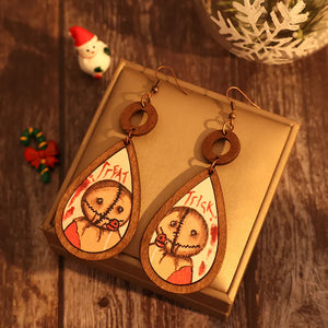Sam Trick or Treat wood teardrop earrings with character illustration and text.