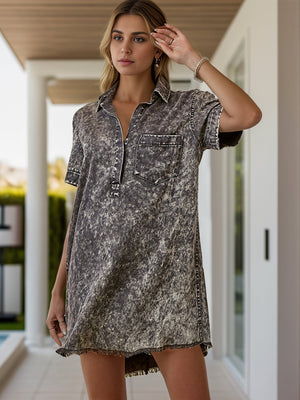 Acid wash shirtdress in charcoal with contrast stitching and a frayed hem.