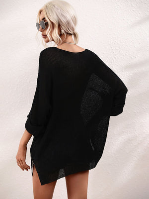Black relaxed fit knit tunic with boat neck and cuffed 3/4 sleeves.