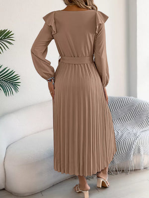 Khaki midi dress with ruffled shoulders, long sleeves, belted waist, and pleated skirt.
