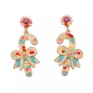 Festive candy cane bow earrings with colorful beads and pearl accents.