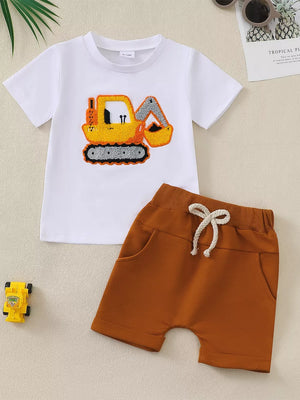 White excavator embroidered baby t-shirt and brown shorts with drawstring.