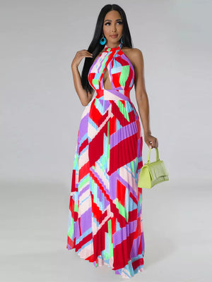 Halter neck maxi dress with geometric print, cut-out, and pleated skirt.