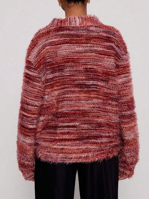 Cozy textured knit cardigan in a marled rust and pink blend with a fuzzy finish and ribbed neckline.