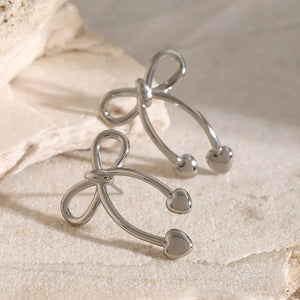 Silver bow drop earrings with heart tips