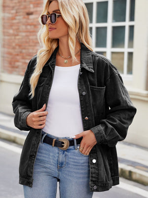 Black oversized denim shacket with button-down front and chest pocket.