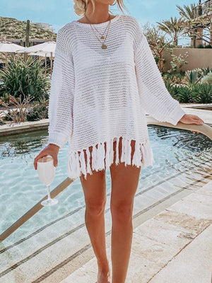 White open-knit acrylic beach cover-up with fringe hem, long sleeves and crew neck.