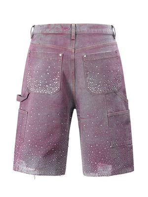 Fuchsia pink denim bermuda shorts with allover crystal embellishments and distressed hem.