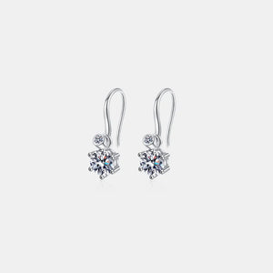 Silver drop earrings with a large solitaire stone and a smaller accent stone.