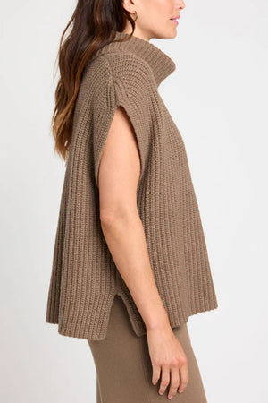 Sleeveless ribbed turtleneck sweater in taupe with a relaxed fit and side slits.